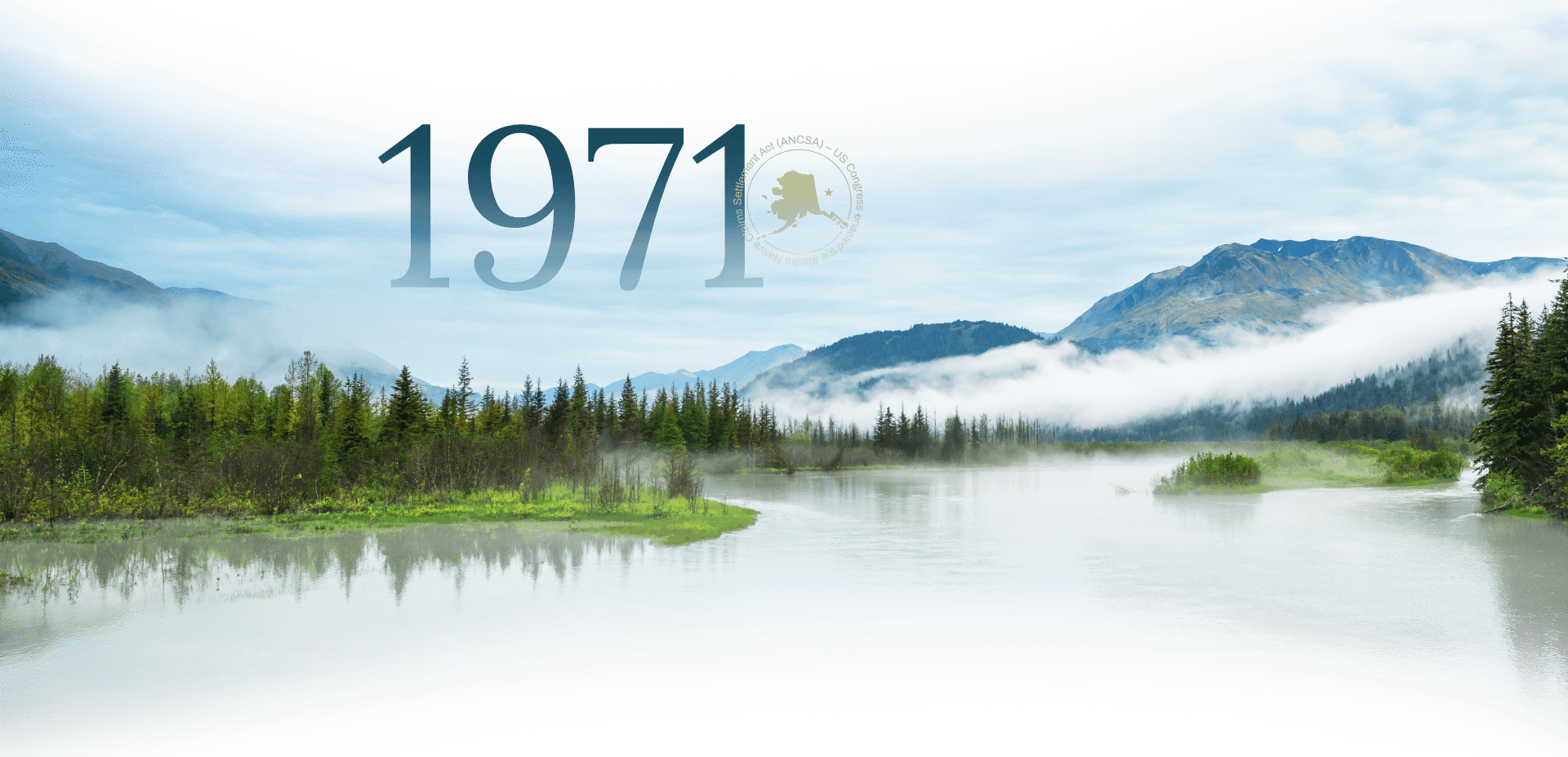 Tall trees alongside water with mountain views.